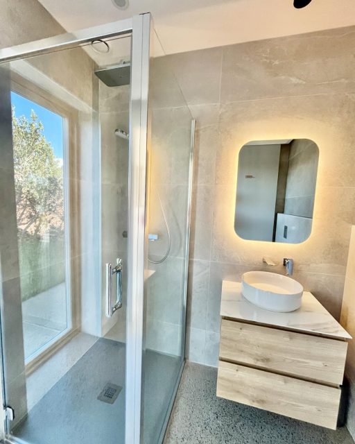 Small and Spacious
 
As we stay indoors to watch #StormKathleen pass through, I can take a moment to share some finished parts of our home. It’s so true what people say that once you move into a new home, progress becomes significantly slower and you also just want to hibernate.  Now that spring is here and the clocks have sprung forward, there is definitely renewed energy to plan the summer projects. 
 
Next on our Instagram tour is our guest ensuite, it’s a great example of how small rooms can still feel spacious, measuring 2 metres by 2.2 metres.  It demonstrates how you can use design to enhance that sense of space. This requires planning the position of windows, doors and sanitaryware at an early stage to maximise the ergonomics of the space, you don’t figure this out on site. 
 
Here are some of the tips to make small feel spacious: 
 
-       Keep it simple, minimise the number of colours and materials
-       We continued the same polished concrete floor from the bedroom to the bathroom
-       Use large format tiles on the walls, so the eye is not focusing on grout joints
-       Tile trims are in matt aluminium finish so they don’t catch your eye 
-       Floor to high level windows continue the perception of floor to the outside, we used clear glass, there is a recessed blind for privacy when needed ;) 
-       Use sliding doors so floor space is not taken up with a door swing, or door is not blocking light of window 
-       Use wall hung toilet and vanity unit so space flows underneath and it’s also easier to clean and mop
-       Use a variety of indirect recessed lighting, this will give a focus to the materials rather than shining in your eyes
-       Back lit mirror also does a good job of creating relaxed soft lighting
-       I also wanted to avoid looking into a room and seeing a toilet straight away, so it’s located behind the wall. This allows us to leave the door open to give more feeling of space in the guest room 
 
The storm has not been too bad today, it forces us to slow down and it’s a good excuse to look out at the elements from our protective shell. Happy Spring! #bathroomdesign #lessismore #moderndesign #designflow #dreambathroom